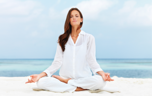 woman yoga pose on beach